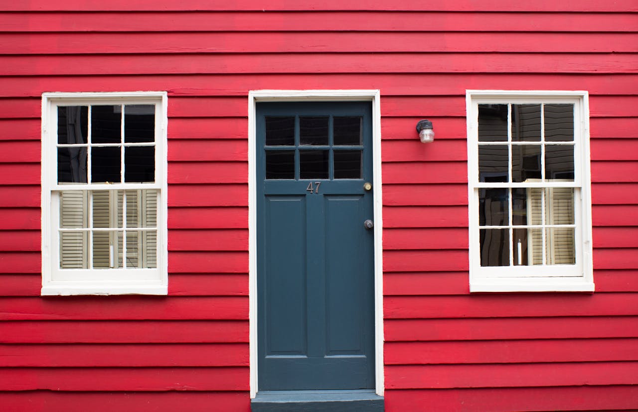 Classic red house with a blue door in Annapolis, MD.